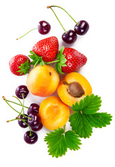 Fresh berries and fruits in still life top view