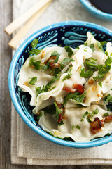 Chinese dumplings with fried onion and soy sauce