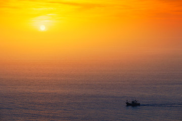 fishing ship at sunset