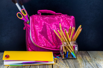 school supplies on wooden background