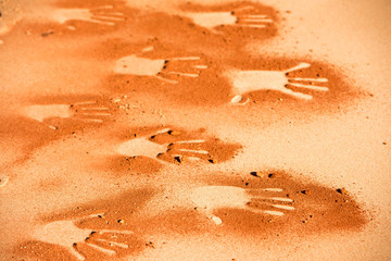 hand shape on sand like aboriginal art style