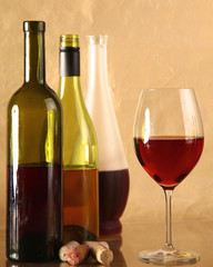 on the table a bottle of wine and a glass of