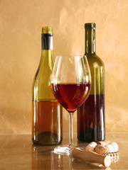 on the table a bottle of wine and a glass of