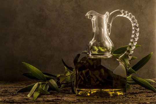 Virgin olive oil in luxurious old oil jar