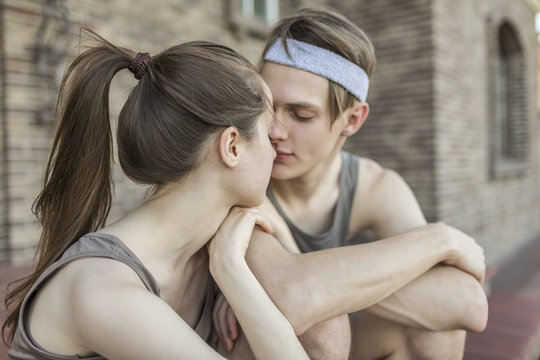 Loving young couple kissing outdoors