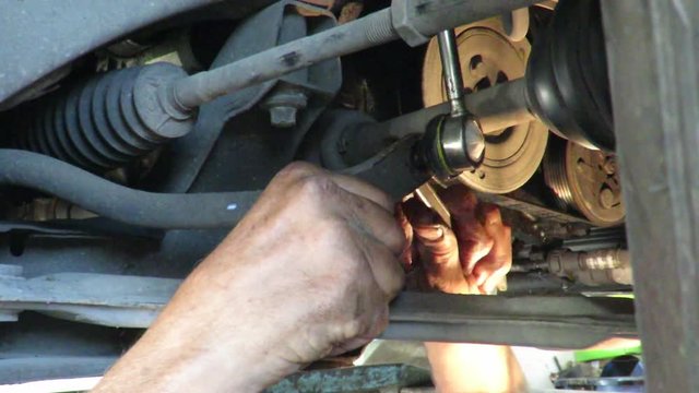 mechanic working under the bridge crane