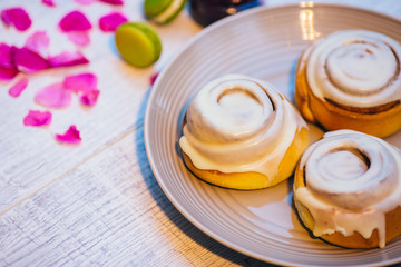 colorful macarons served on wooden dish