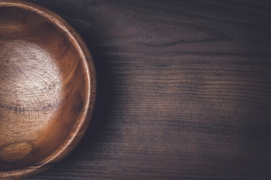 Wooden Salad Bowl On The Brown Table