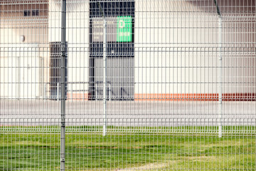 Obraz premium Metal fence by the stadium.