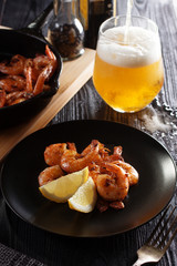 Fried shrimps with light beer glass