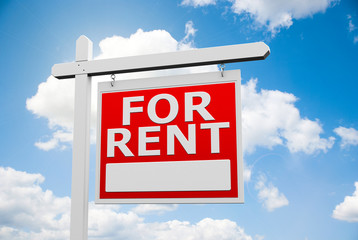 For Rent signpost on sky