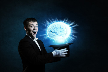 Man magician with cylinder hat