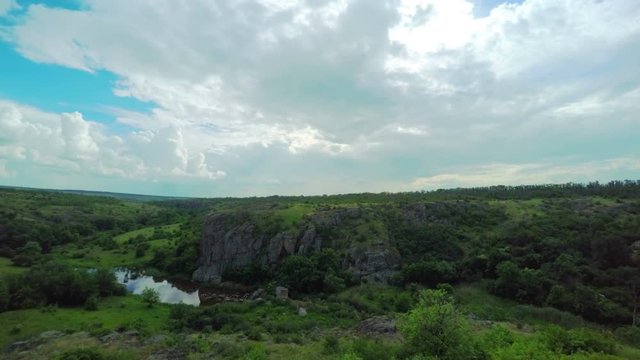 White Fluffy Clouds over the Canyon. Central Ukraine. Timelapse. 4K.
