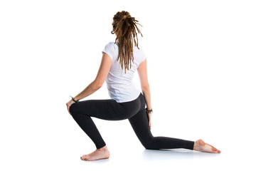 Fototapeta premium Young girl with dreadlocks doing yoga