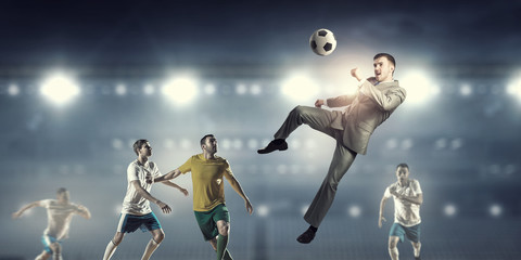 Businessman and players fighting for ball