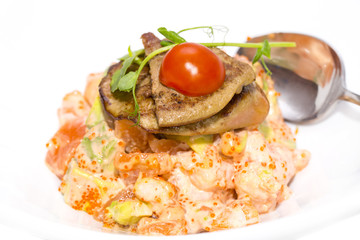 salad, fish and eggs decorated with greens and tomatoes