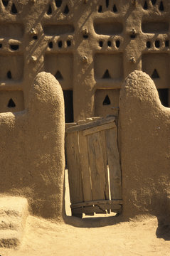 Primative wooden gate at entrance to a Mali, West Africa mosque