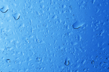 Blue water drops background. Blue background wet water drops.