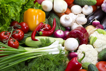 Background of fresh vegetables and greens closeup