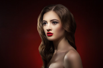 Fototapeta premium Portrait of beautiful woman with make-up and wavy hair