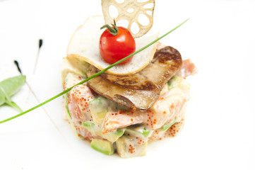 salad, fish and eggs decorated with greens and tomatoes