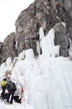 Two skiers prepare for ice climb at Lagazuoi, South Tyrol, Italy
