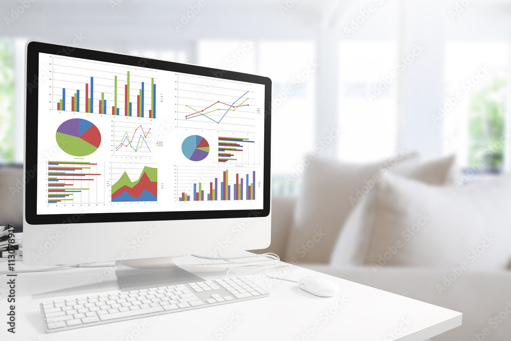 Poster Modern computer with keyboard and mouse on table showing charts