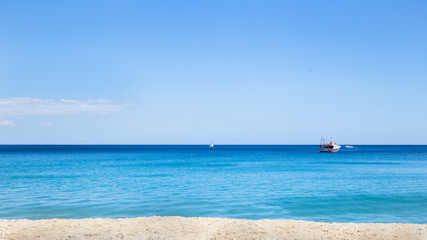 A yaucht in the turquoise sea waters