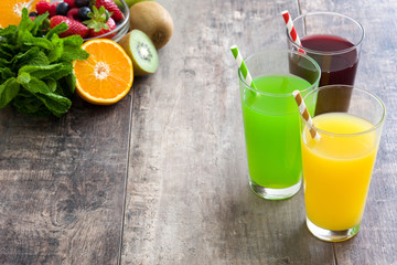 Fresh fruit smoothies on a rustic wooden table

