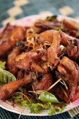 Thai style fried chicken with herb.