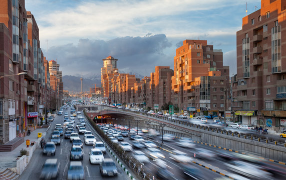 Tehran Cityscape with Sunlit Navvab Buildings and Cars Passing Through Tohid Tunnel