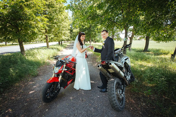 Fototapeta na wymiar Wedding photo session with motorcycle