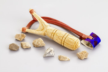 Wooden catapult slingshot with stone bullets
