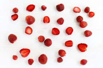 strawberry background/ flat lay plurality of of red strawberries on a wooden surface top view 