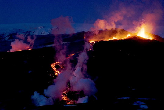 Night view of lava flowing down from Eyjafjallajokull volcano, Iceland