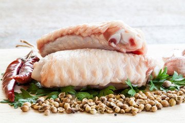 raw chicken wings on chopping board