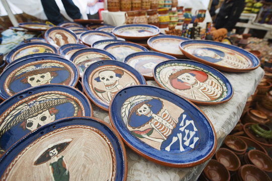 Skeleton pattern on ceramics for sale in the market during Day of the Dead festival, Patzcuaro, Michoacan state, Mexico