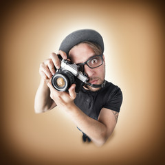 Funny man surprise shooting with photo camera
