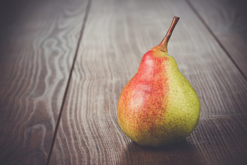 fresh pear on the brown wooden table