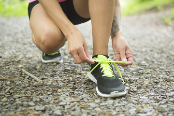 sporty woman running outdoors in park