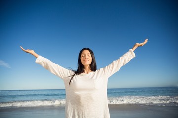 Woman standing with arms outstretched