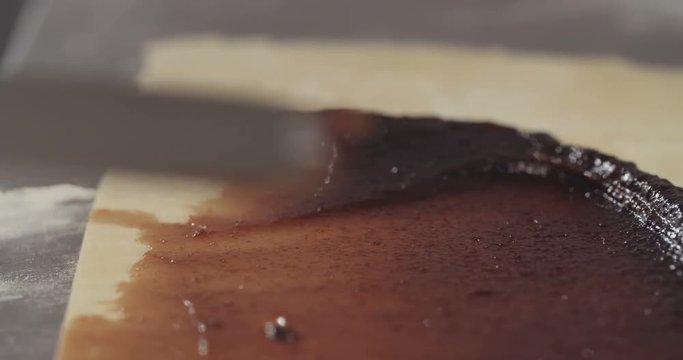 Bakers Prepare A Plum Jam Filled Strudel 