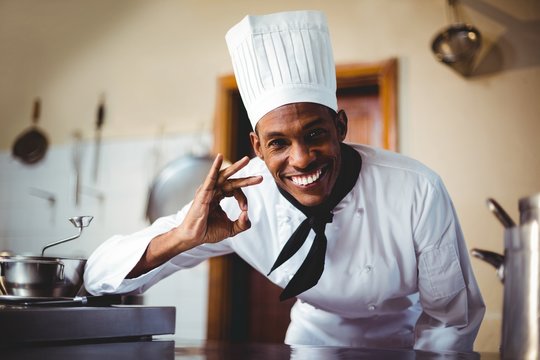 Portrait of happy chef making ok sign