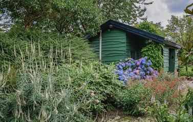 Garden house in the green in the garden.