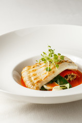 Grilled turbot, tabouli, sweet pepper sauce and summer vegetables. White dish