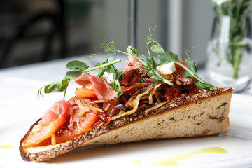 Cabbage snack with bacon on sour-sweet bread