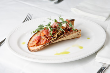 Cabbage snack with bacon on sour-sweet bread