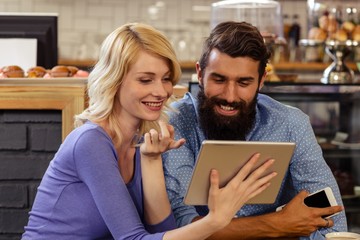 Couple using a tablet computer