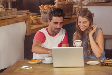 Couple using a laptop