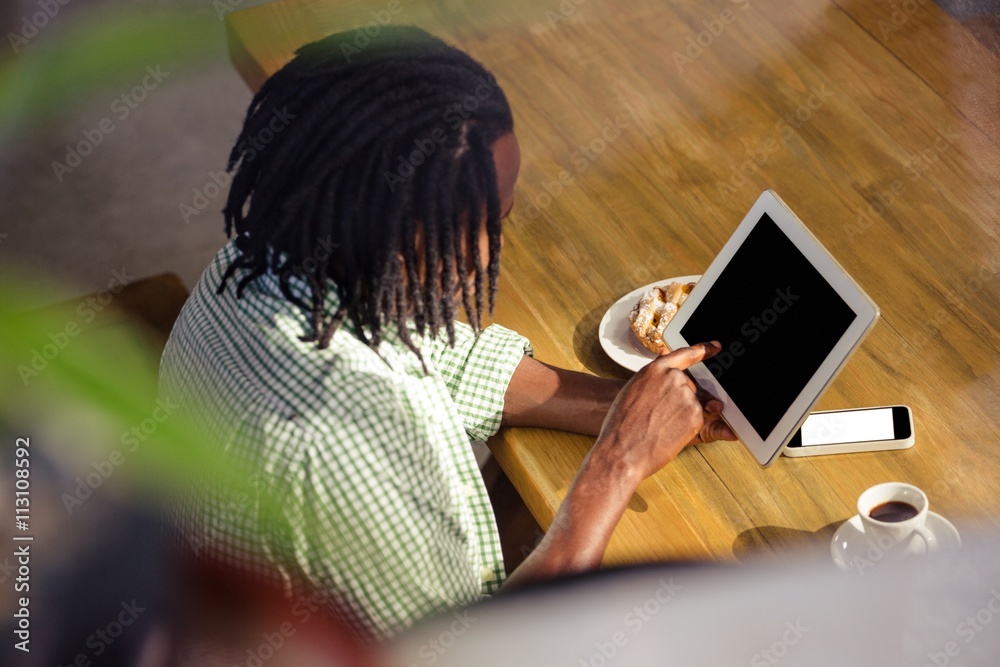 Poster Man using a tablet sitting